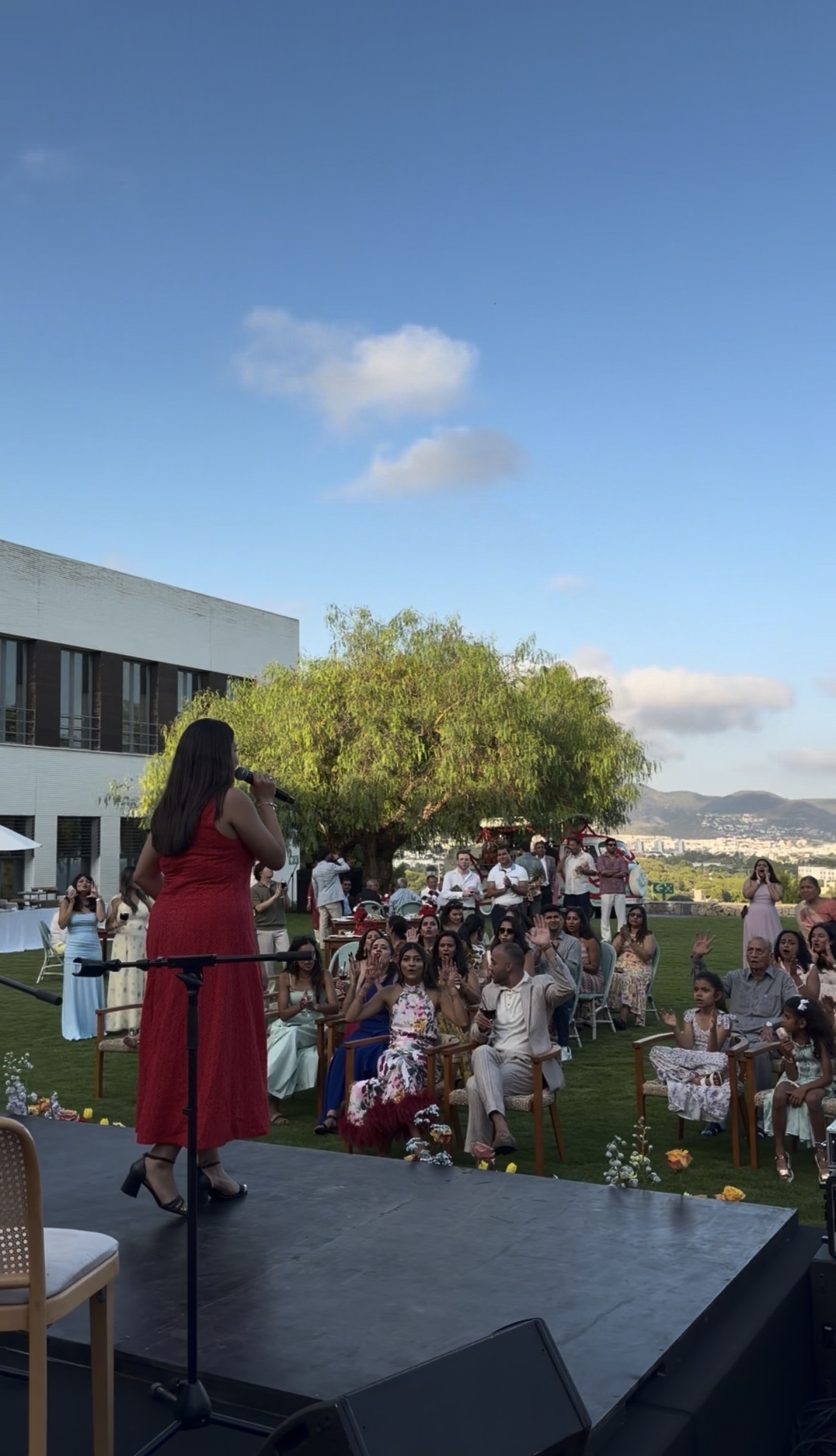 MC Devi hosting an outdoor celebration