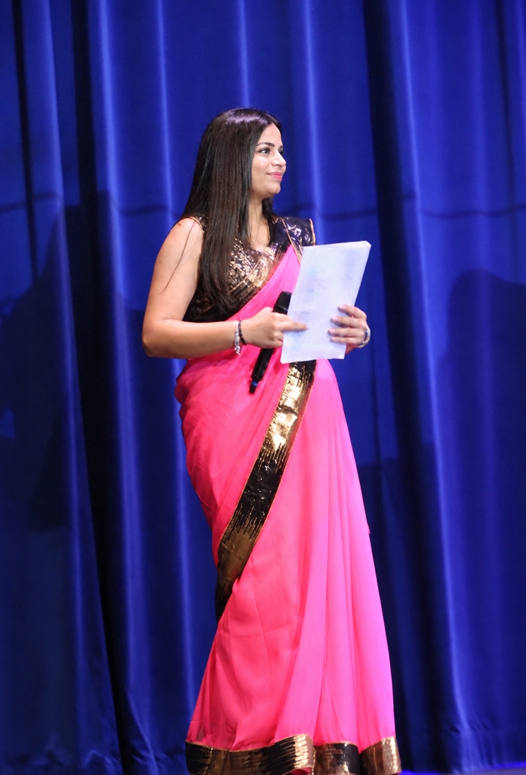 MC Devi hosting on stage